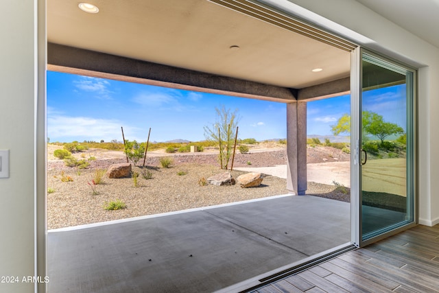 doorway to outside with hardwood / wood-style floors