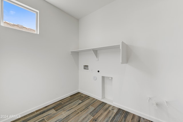 washroom featuring hookup for a washing machine, hookup for a gas dryer, dark hardwood / wood-style floors, and electric dryer hookup