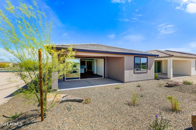 rear view of property with a patio