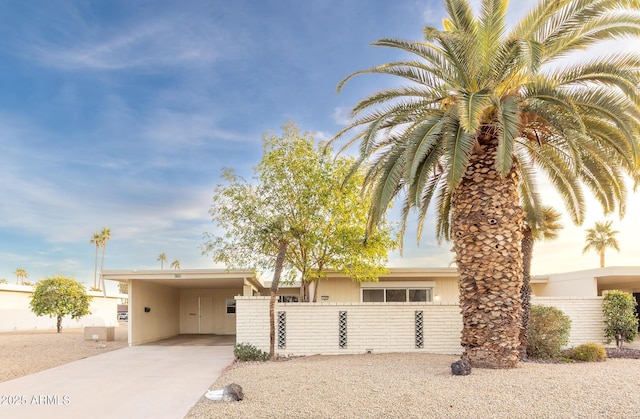 view of front of home featuring a carport