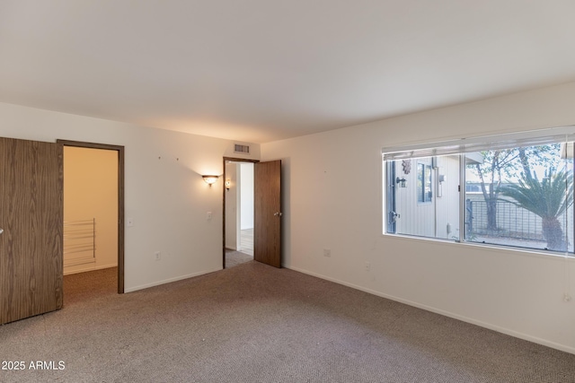 unfurnished bedroom featuring dark colored carpet