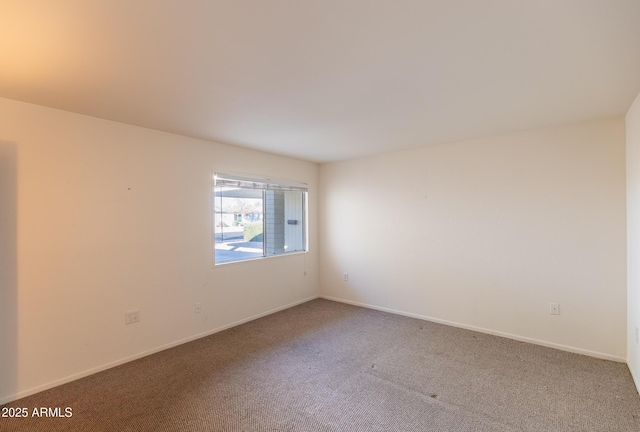 unfurnished room with carpet flooring