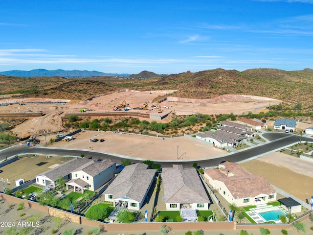 birds eye view of property with a mountain view