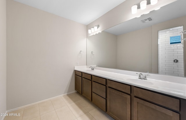 bathroom featuring tile patterned floors and double sink vanity