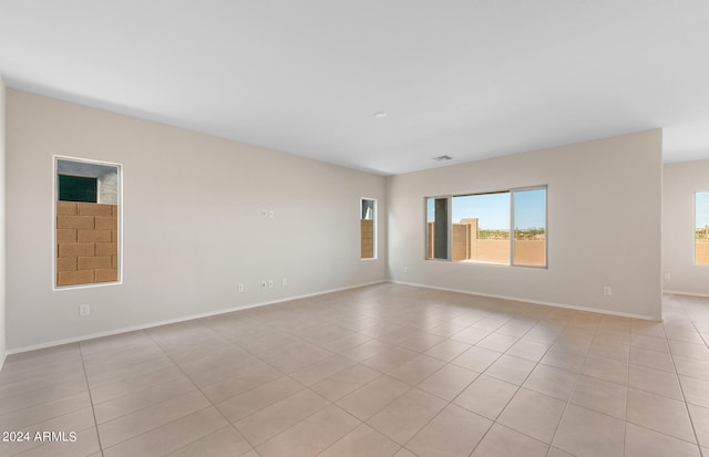 unfurnished room with light tile patterned floors