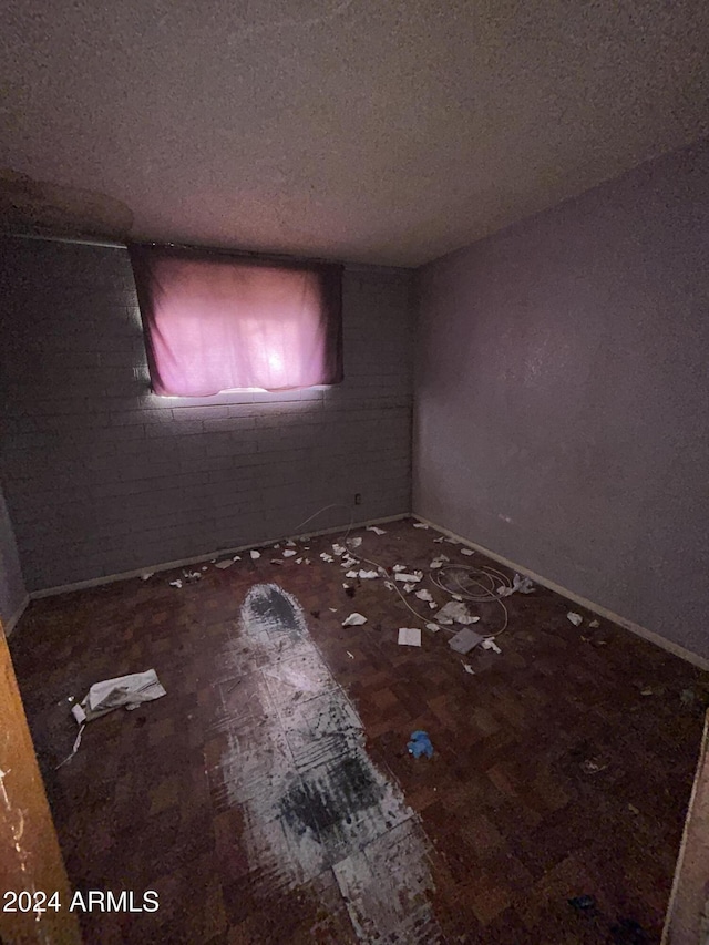 spare room featuring a textured ceiling