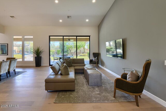 12225 E Cortez Dr, Scottsdale, AZ 85259 - living area featuring a wealth of natural light, visible vents, baseboards, and wood finished floors
