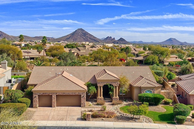 12225 E Cortez Dr, Scottsdale, AZ 85259 - ranch-style home featuring a tiled roof, a mountain view, an attached garage, driveway, and a residential view