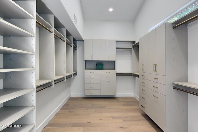 12225 E Cortez Dr, Scottsdale, AZ 85259 - spacious closet featuring light wood-style floors and visible vents