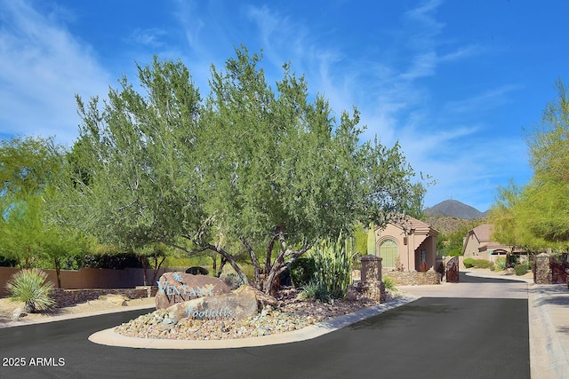 12225 E Cortez Dr, Scottsdale, AZ 85259 - view of road with a mountain view, a gated entry, and curbs