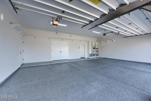 12225 E Cortez Dr, Scottsdale, AZ 85259 - garage featuring a garage door opener and baseboards