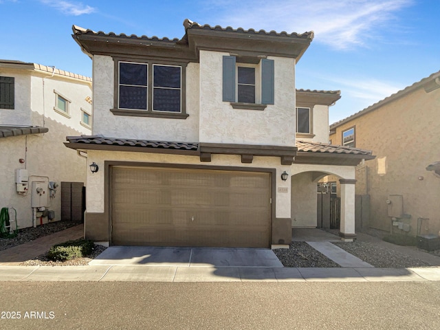 mediterranean / spanish house featuring a garage