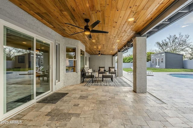11942 N 95th St, Scottsdale, AZ 85260 - view of patio with a ceiling fan, an outdoor pool, an outbuilding, and outdoor lounge area