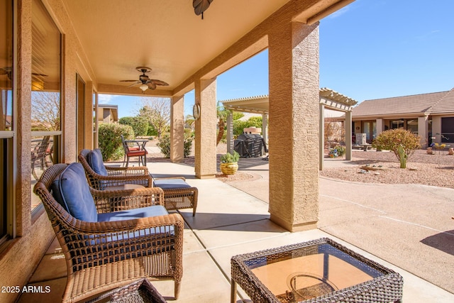 view of patio / terrace featuring a ceiling fan and a pergola