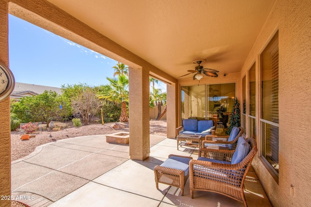 view of patio featuring ceiling fan and fence