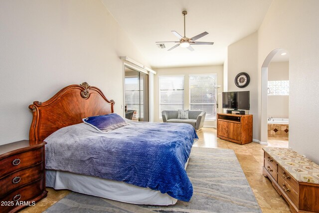 bedroom with arched walkways, lofted ceiling, visible vents, light tile patterned flooring, and connected bathroom