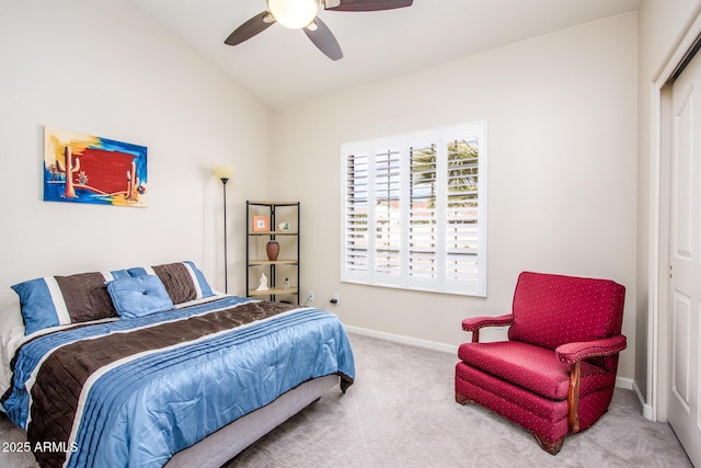 carpeted bedroom featuring ceiling fan, vaulted ceiling, and baseboards