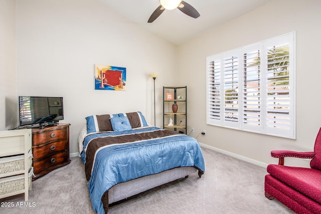 bedroom featuring lofted ceiling, a ceiling fan, baseboards, and carpet flooring