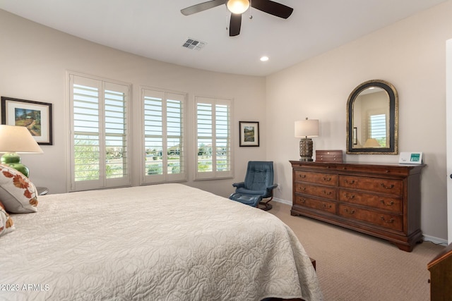 4149 N Brigadier Dr, Florence, AZ 85132 - bedroom with light carpet, multiple windows, visible vents, and recessed lighting