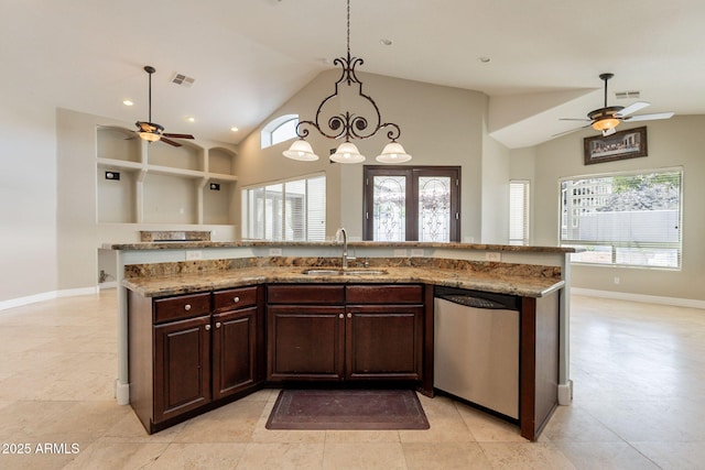 2701 E Caldwell St, Phoenix, AZ 85042 - kitchen with stainless steel dishwasher, a sink, a ceiling fan, and a wealth of natural light