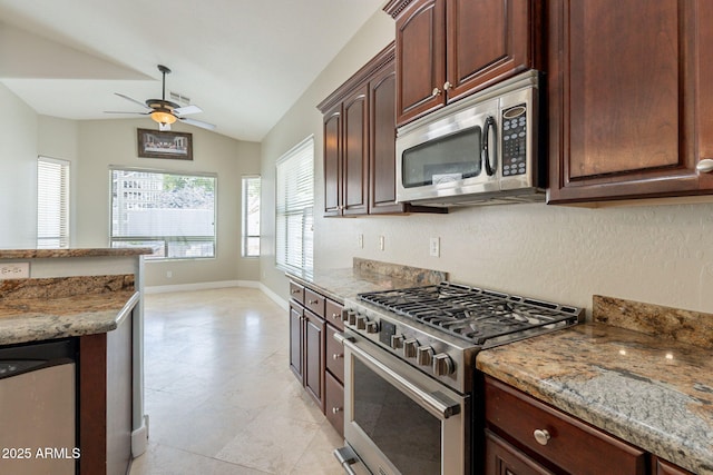 2701 E Caldwell St, Phoenix, AZ 85042 - kitchen featuring a ceiling fan, appliances with stainless steel finishes, vaulted ceiling, baseboards, and light stone counters