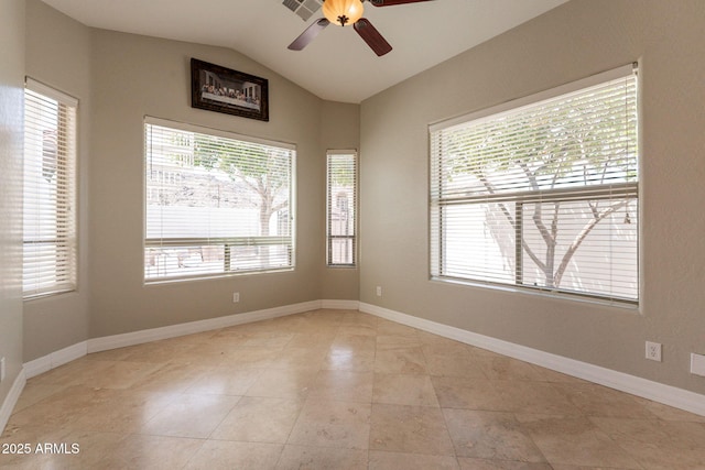 2701 E Caldwell St, Phoenix, AZ 85042 - empty room with light tile patterned flooring, ceiling fan, vaulted ceiling, and baseboards