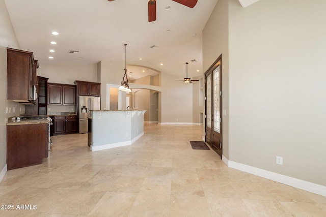 2701 E Caldwell St, Phoenix, AZ 85042 - kitchen featuring open floor plan, ceiling fan, high vaulted ceiling, stainless steel refrigerator with ice dispenser, and arched walkways