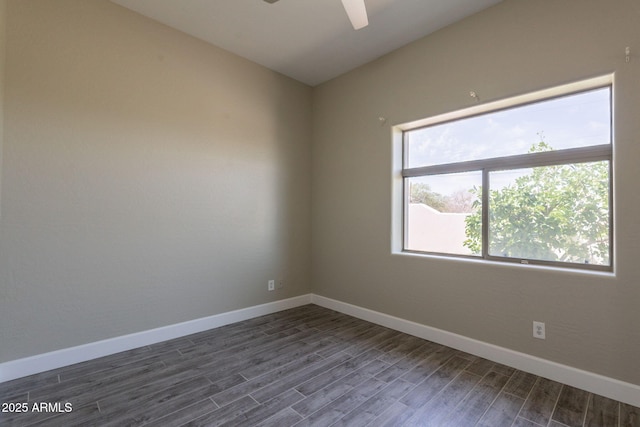 2701 E Caldwell St, Phoenix, AZ 85042 - empty room featuring baseboards, a ceiling fan, and dark wood-type flooring