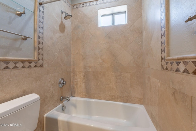 2701 E Caldwell St, Phoenix, AZ 85042 - bathroom featuring shower / washtub combination, toilet, and tile walls