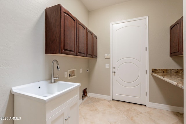 2701 E Caldwell St, Phoenix, AZ 85042 - clothes washing area featuring washer hookup, hookup for an electric dryer, cabinet space, light tile patterned floors, and baseboards