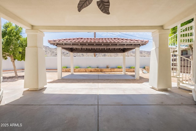 2701 E Caldwell St, Phoenix, AZ 85042 - view of patio featuring a fenced backyard, a ceiling fan, and stairs