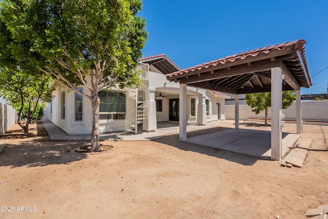 2701 E Caldwell St, Phoenix, AZ 85042 - back of house featuring a patio, ceiling fan, fence, and a tile roof