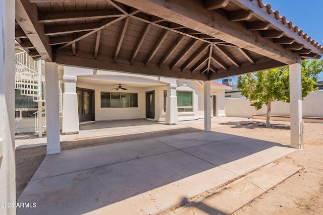2701 E Caldwell St, Phoenix, AZ 85042 - view of patio featuring fence, a ceiling fan, and stairs