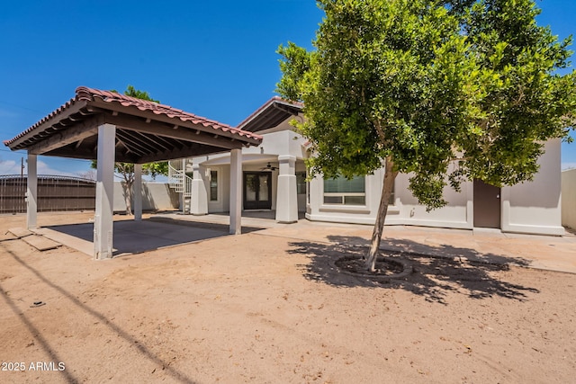 2701 E Caldwell St, Phoenix, AZ 85042 - rear view of property featuring fence, a patio, a ceiling fan, a gazebo, and a tile roof
