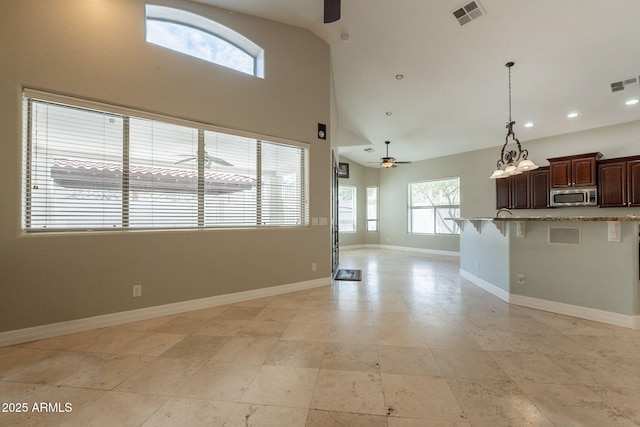 2701 E Caldwell St, Phoenix, AZ 85042 - unfurnished living room featuring ceiling fan, visible vents, and baseboards