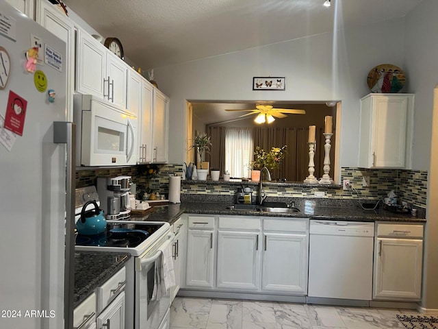 kitchen with white cabinets, white appliances, ceiling fan, and vaulted ceiling