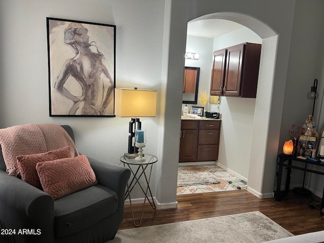 sitting room featuring dark hardwood / wood-style flooring