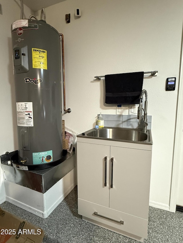 utilities with water heater and a sink