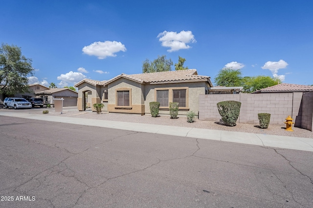 6317 S Kimberlee Way, Chandler, AZ 85249 - mediterranean / spanish-style house featuring stucco siding, concrete driveway, a tile roof, and a garage