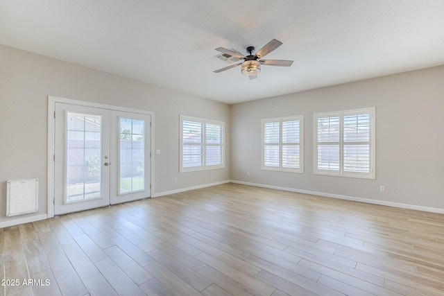 6317 S Kimberlee Way, Chandler, AZ 85249 - spare room with a ceiling fan, baseboards, french doors, and light wood-style flooring