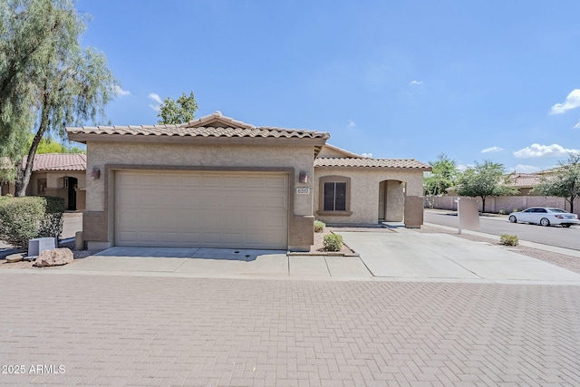 6317 S Kimberlee Way, Chandler, AZ 85249 - mediterranean / spanish house with stucco siding, a tile roof, driveway, and an attached garage