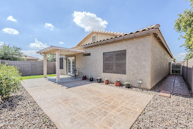 6317 S Kimberlee Way, Chandler, AZ 85249 - rear view of house with stucco siding, a patio area, and a fenced backyard