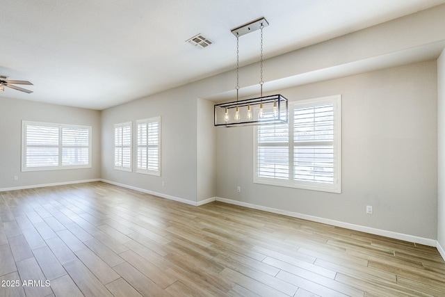 6317 S Kimberlee Way, Chandler, AZ 85249 - spare room featuring ceiling fan, baseboards, and light wood-style floors