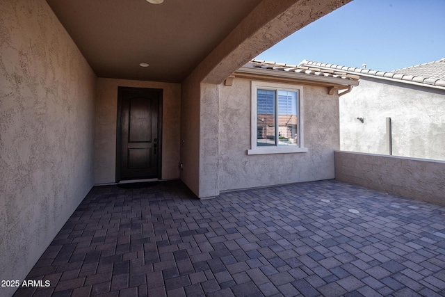 26421 W Zachary Dr, Buckeye, AZ 85396 - entrance to property with a patio and stucco siding