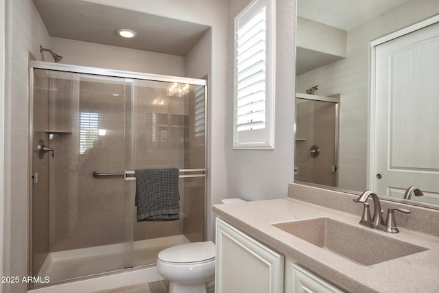 26421 W Zachary Dr, Buckeye, AZ 85396 - full bathroom with toilet, a stall shower, and a healthy amount of sunlight