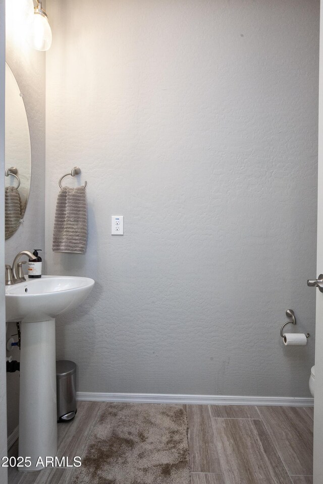 26421 W Zachary Dr, Buckeye, AZ 85396 - half bath featuring wood finished floors and baseboards