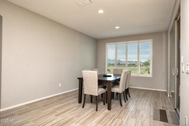 26421 W Zachary Dr, Buckeye, AZ 85396 - dining room with visible vents, baseboards, recessed lighting, and light wood-style floors