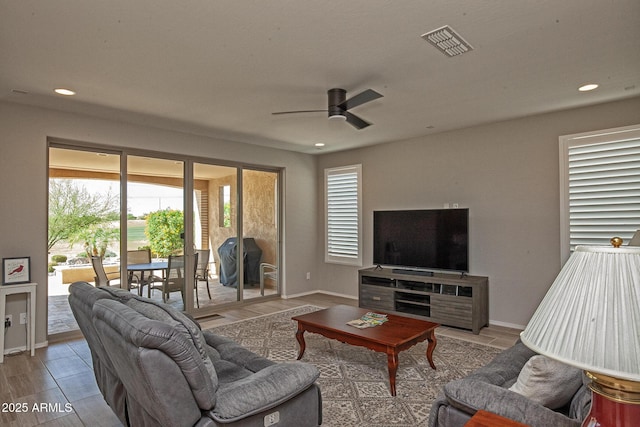 26421 W Zachary Dr, Buckeye, AZ 85396 - living room with ceiling fan, visible vents, recessed lighting, wood finished floors, and baseboards