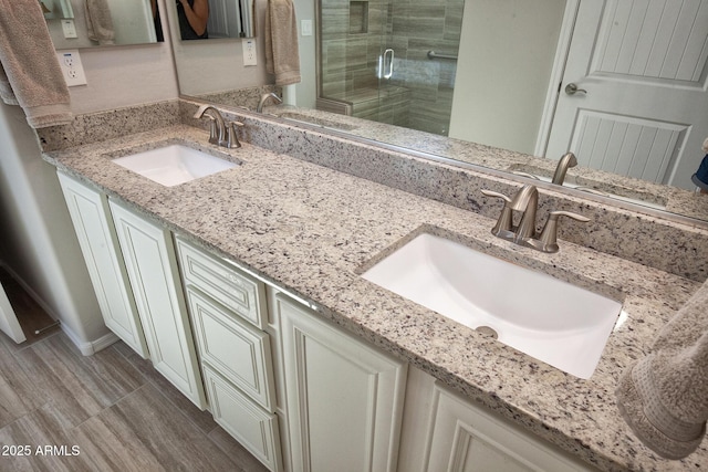 26421 W Zachary Dr, Buckeye, AZ 85396 - bathroom with double vanity, a sink, and a stall shower