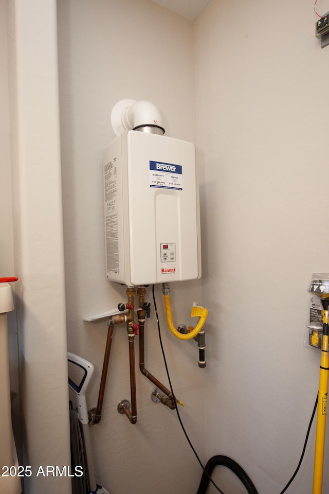 26421 W Zachary Dr, Buckeye, AZ 85396 - utility room featuring tankless water heater